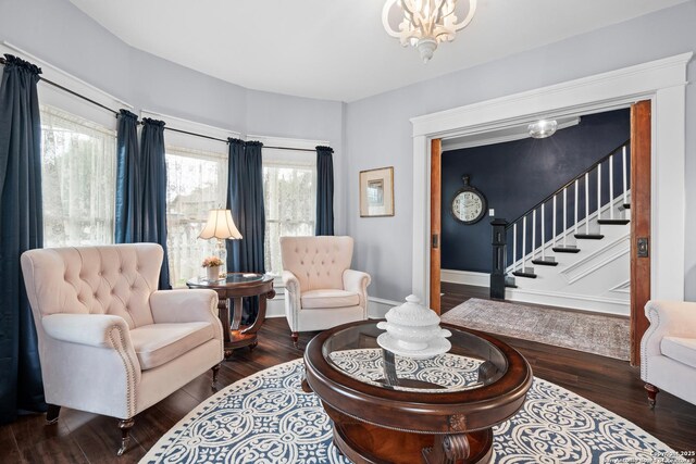 508 Main, Marble Falls, TX 78654 - living room with hardwood / wood-style flooring, stairway, baseboards, and a chandelier
