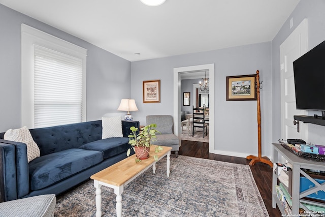 508 Main, Marble Falls, TX 78654 - living area featuring a chandelier, wood finished floors, and baseboards