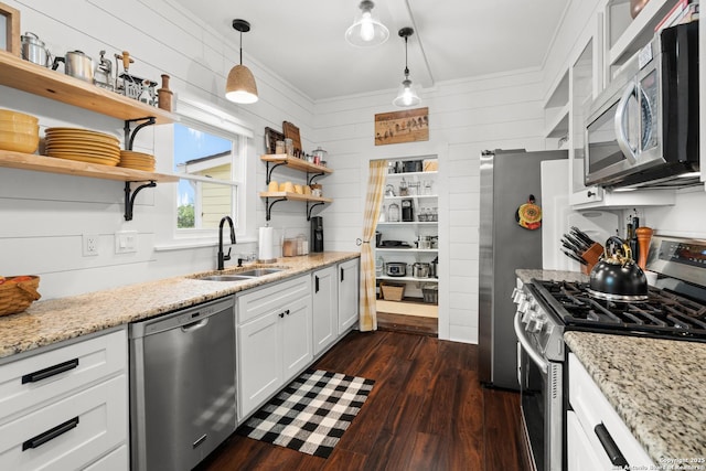 508 Main, Marble Falls, TX 78654 - kitchen featuring appliances with stainless steel finishes, open shelves, a sink, white cabinetry, and dark wood-style floors