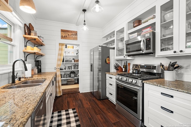 508 Main, Marble Falls, TX 78654 - kitchen with stainless steel appliances, a sink, open shelves, dark wood-type flooring, and white cabinets