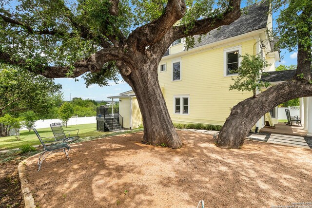 508 Main, Marble Falls, TX 78654 - rear view of house with stairway, a yard, a wooden deck, and a shingled roof