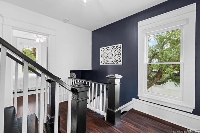 508 Main, Marble Falls, TX 78654 - stairs with plenty of natural light, wood finished floors, a ceiling fan, and baseboards