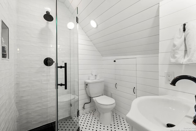 508 Main, Marble Falls, TX 78654 - full bathroom featuring a sink, a stall shower, lofted ceiling, toilet, and tile walls