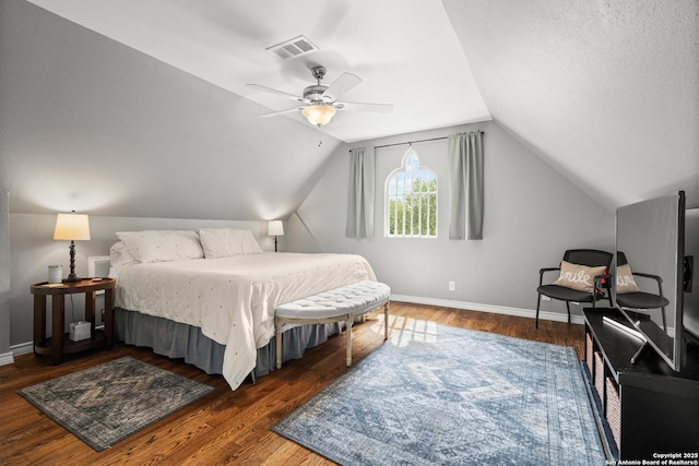 508 Main, Marble Falls, TX 78654 - bedroom with baseboards, wood finished floors, lofted ceiling, and a ceiling fan