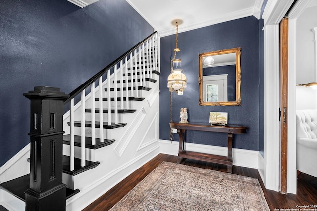 508 Main, Marble Falls, TX 78654 - stairs featuring wood finished floors, crown molding, baseboards, and a textured wall
