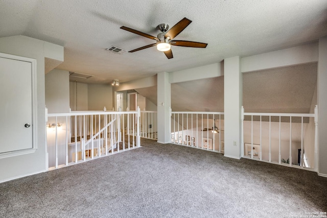1027 Hedgestone, San Antonio, TX 78258 - unfurnished room with ceiling fan, carpet, attic access, and a textured ceiling
