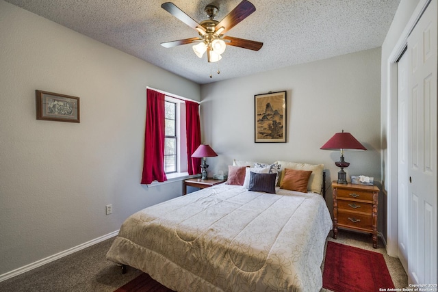 1027 Hedgestone, San Antonio, TX 78258 - carpeted bedroom featuring a closet, a textured ceiling, baseboards, and a ceiling fan