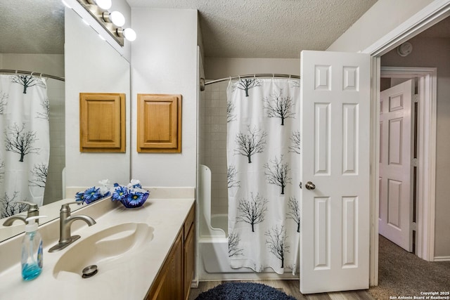 1027 Hedgestone, San Antonio, TX 78258 - bathroom featuring a textured ceiling, vanity, and shower / bath combo