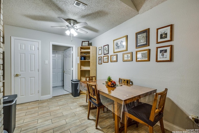 1027 Hedgestone, San Antonio, TX 78258 - dining area featuring a ceiling fan, a textured ceiling, baseboards, and light wood-style floors