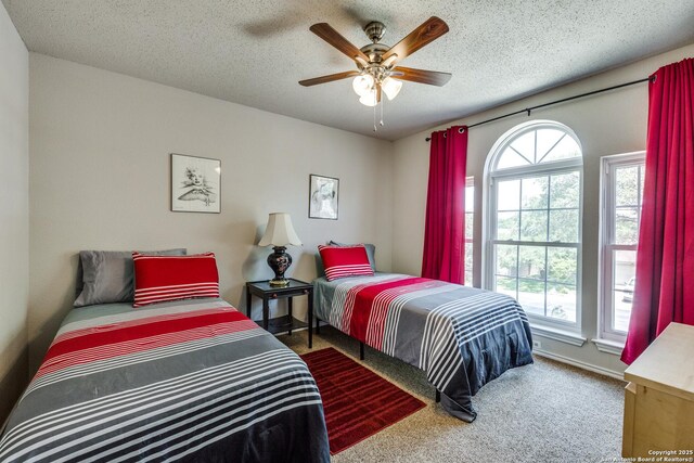 1027 Hedgestone, San Antonio, TX 78258 - carpeted bedroom with a ceiling fan and a textured ceiling