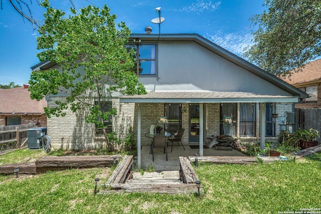 1027 Hedgestone, San Antonio, TX 78258 - rear view of house featuring central air condition unit, a patio area, and brick siding