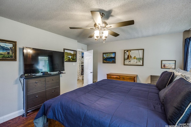 1027 Hedgestone, San Antonio, TX 78258 - bedroom with dark wood-type flooring, a textured ceiling, baseboards, and ceiling fan