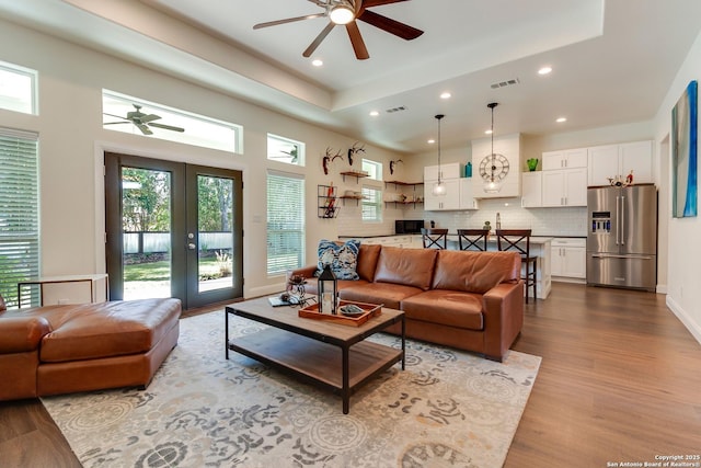 224 Frey, Boerne, TX 78006 - living room featuring a ceiling fan, recessed lighting, dark wood finished floors, and a raised ceiling