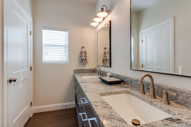 224 Frey, Boerne, TX 78006 - full bathroom featuring wood finished floors, baseboards, and double vanity