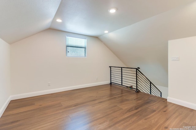 224 Frey, Boerne, TX 78006 - additional living space featuring vaulted ceiling, wood finished floors, baseboards, and recessed lighting