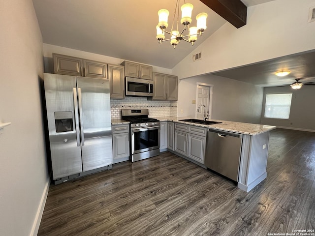 224 Frey, Boerne, TX 78006 - kitchen featuring appliances with stainless steel finishes, gray cabinets, a sink, dark wood-type flooring, and beam ceiling