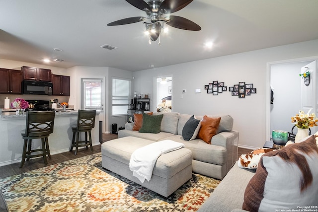 14718 Fronted Goose, San Antonio, TX 78253 - living area featuring ceiling fan, dark wood-style floors, and baseboards
