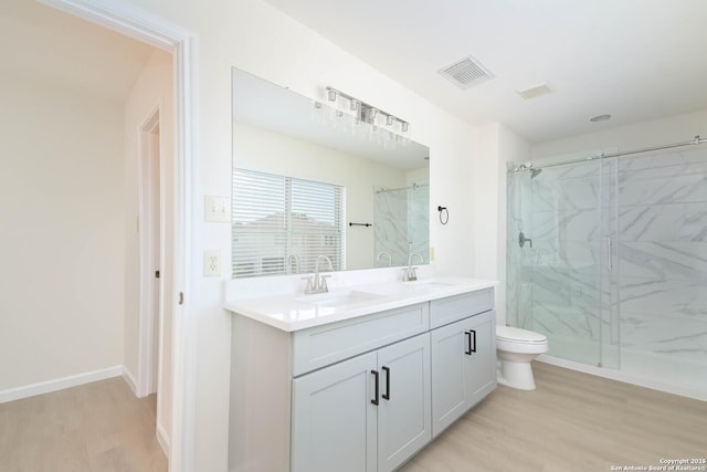 5118 Kayla Brk, San Antonio, TX 78251 - full bathroom featuring wood finished floors, a marble finish shower, toilet, and double vanity