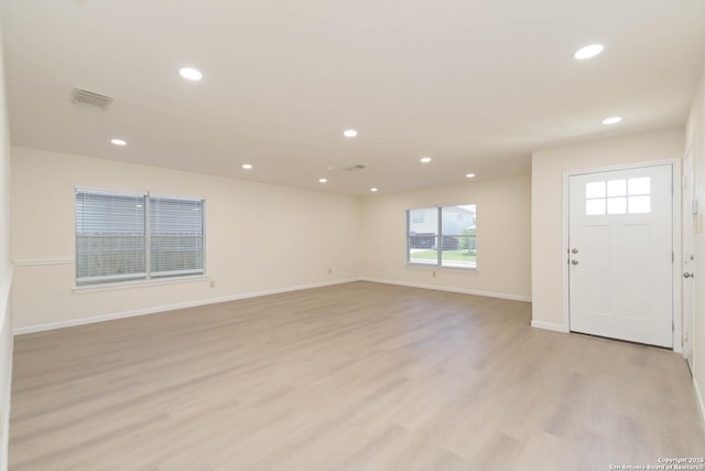 5118 Kayla Brk, San Antonio, TX 78251 - unfurnished living room featuring light wood-style floors, recessed lighting, and baseboards