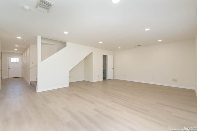 5118 Kayla Brk, San Antonio, TX 78251 - unfurnished living room featuring light wood-style flooring, recessed lighting, baseboards, and stairs
