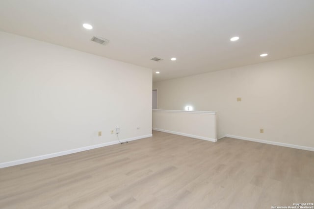 5118 Kayla Brk, San Antonio, TX 78251 - empty room with recessed lighting, light wood finished floors, and baseboards