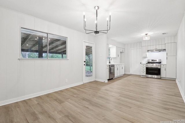 7143 Laurel Valley Dr, San Antonio, TX 78242 - kitchen with appliances with stainless steel finishes, a chandelier, light wood finished floors, light countertops, and a sink