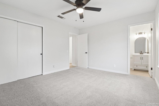 7143 Laurel Valley Dr, San Antonio, TX 78242 - unfurnished bedroom with light colored carpet, a closet, ensuite bath, and baseboards