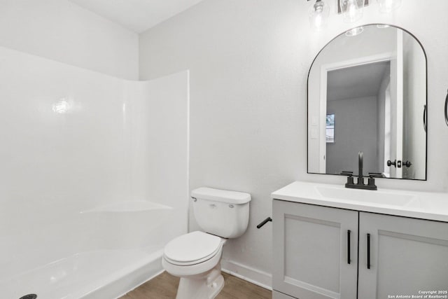 7143 Laurel Valley Dr, San Antonio, TX 78242 - full bath with wood finished floors, toilet, a shower, vanity, and baseboards