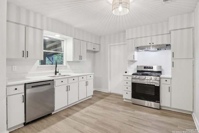 7143 Laurel Valley Dr, San Antonio, TX 78242 - kitchen featuring appliances with stainless steel finishes, a sink, under cabinet range hood, and light countertops