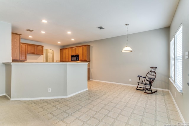 109 Sage Cyn, Boerne, TX 78006 - kitchen featuring black microwave, healthy amount of natural light, recessed lighting, hanging light fixtures, and baseboards