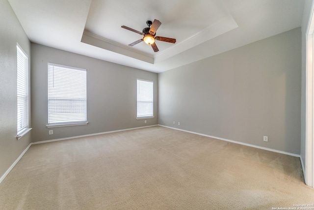 109 Sage Cyn, Boerne, TX 78006 - empty room with a ceiling fan, healthy amount of natural light, a raised ceiling, and baseboards