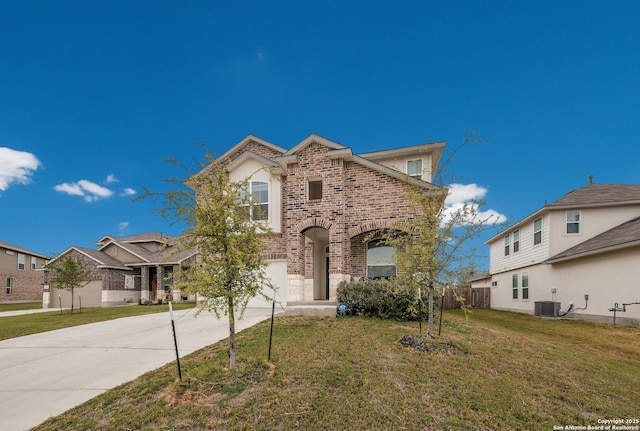 view of front of house with concrete driveway, a front lawn, brick siding, and a garage