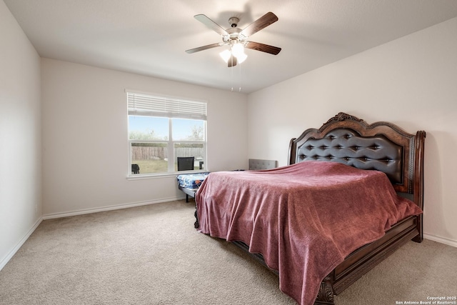 bedroom with carpet, baseboards, and a ceiling fan