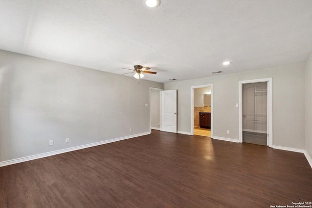 unfurnished living room with baseboards, ceiling fan, dark wood-style floors, and recessed lighting