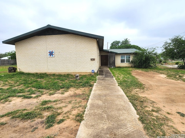 610 N 9th, Carrizo Springs, TX 78834 - view of front of home featuring brick siding