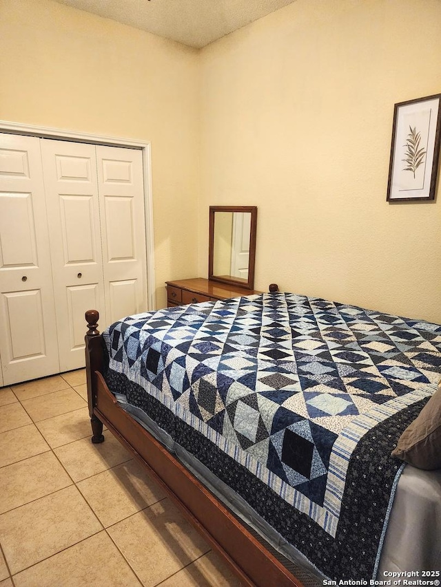 610 N 9th, Carrizo Springs, TX 78834 - bedroom with light tile patterned floors and a closet