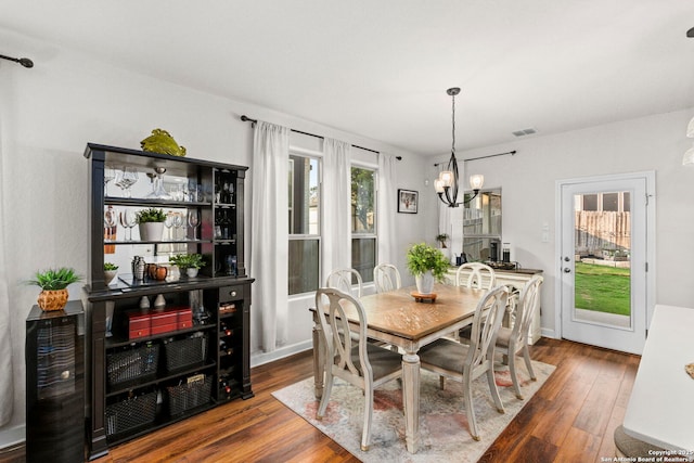 1527 Balcones Fault, New Braunfels, TX 78132 - dining space featuring dark wood finished floors and a chandelier