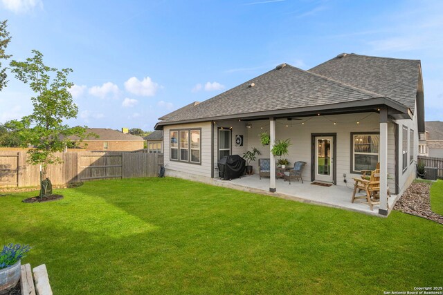 1527 Balcones Fault, New Braunfels, TX 78132 - rear view of house featuring roof with shingles, a patio area, and ceiling fan