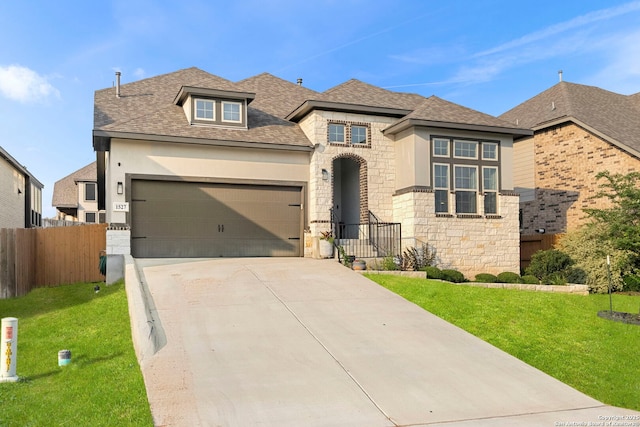 1527 Balcones Fault, New Braunfels, TX 78132 - view of front facade with stone siding, an attached garage, concrete driveway, stucco siding, and a shingled roof