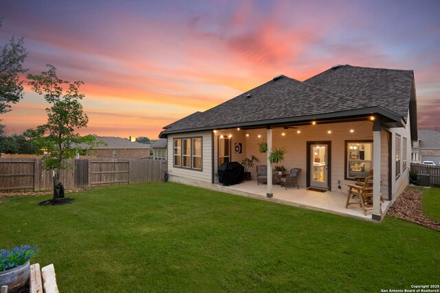 1527 Balcones Fault, New Braunfels, TX 78132 - back of property with a shingled roof and a patio area