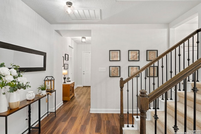 1527 Balcones Fault, New Braunfels, TX 78132 - foyer featuring dark wood-style floors, baseboards, and stairway