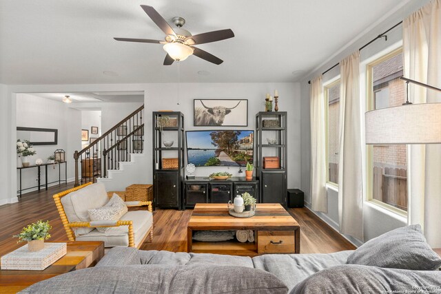 1527 Balcones Fault, New Braunfels, TX 78132 - living room with wood finished floors, a ceiling fan, and stairway
