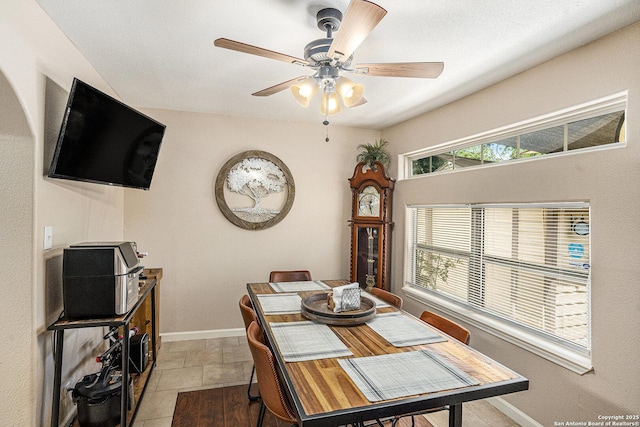 715 E Southcross, San Antonio, TX 78214 - tiled dining space with a ceiling fan and baseboards