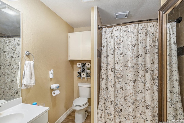 715 E Southcross, San Antonio, TX 78214 - bathroom with toilet, a shower with curtain, vanity, and baseboards