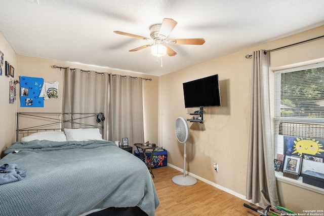 715 E Southcross, San Antonio, TX 78214 - bedroom featuring light wood-style flooring, baseboards, and ceiling fan