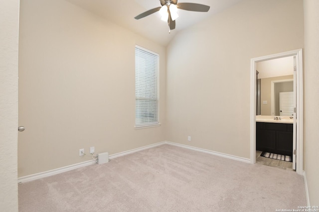 10809 Davis Farms, San Antonio, TX 78254 - unfurnished bedroom featuring light colored carpet, vaulted ceiling, baseboards, ensuite bathroom, and ceiling fan