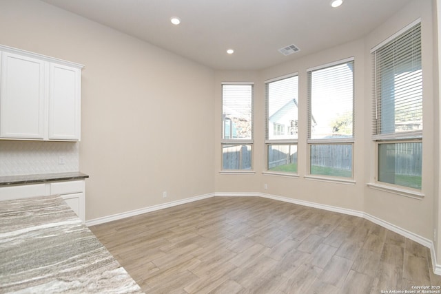 10809 Davis Farms, San Antonio, TX 78254 - unfurnished living room with light wood finished floors, recessed lighting, and baseboards