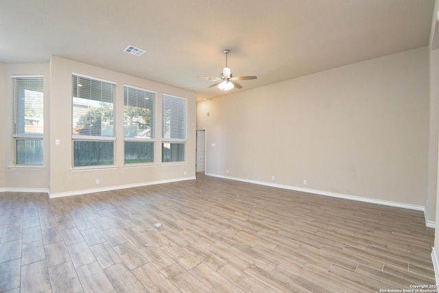 10809 Davis Farms, San Antonio, TX 78254 - spare room with ceiling fan, light wood-style flooring, and baseboards