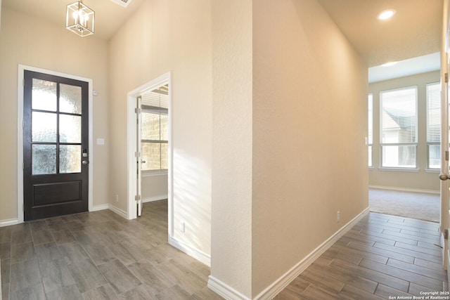 10809 Davis Farms, San Antonio, TX 78254 - foyer featuring wood tiled floors, plenty of natural light, baseboards, and a chandelier