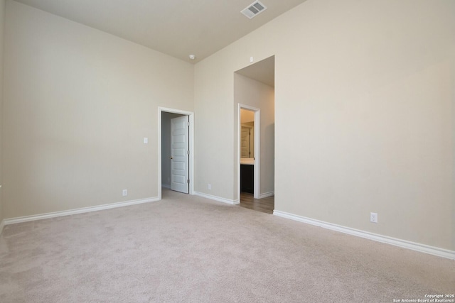 10809 Davis Farms, San Antonio, TX 78254 - unfurnished room featuring light carpet, baseboards, and a towering ceiling